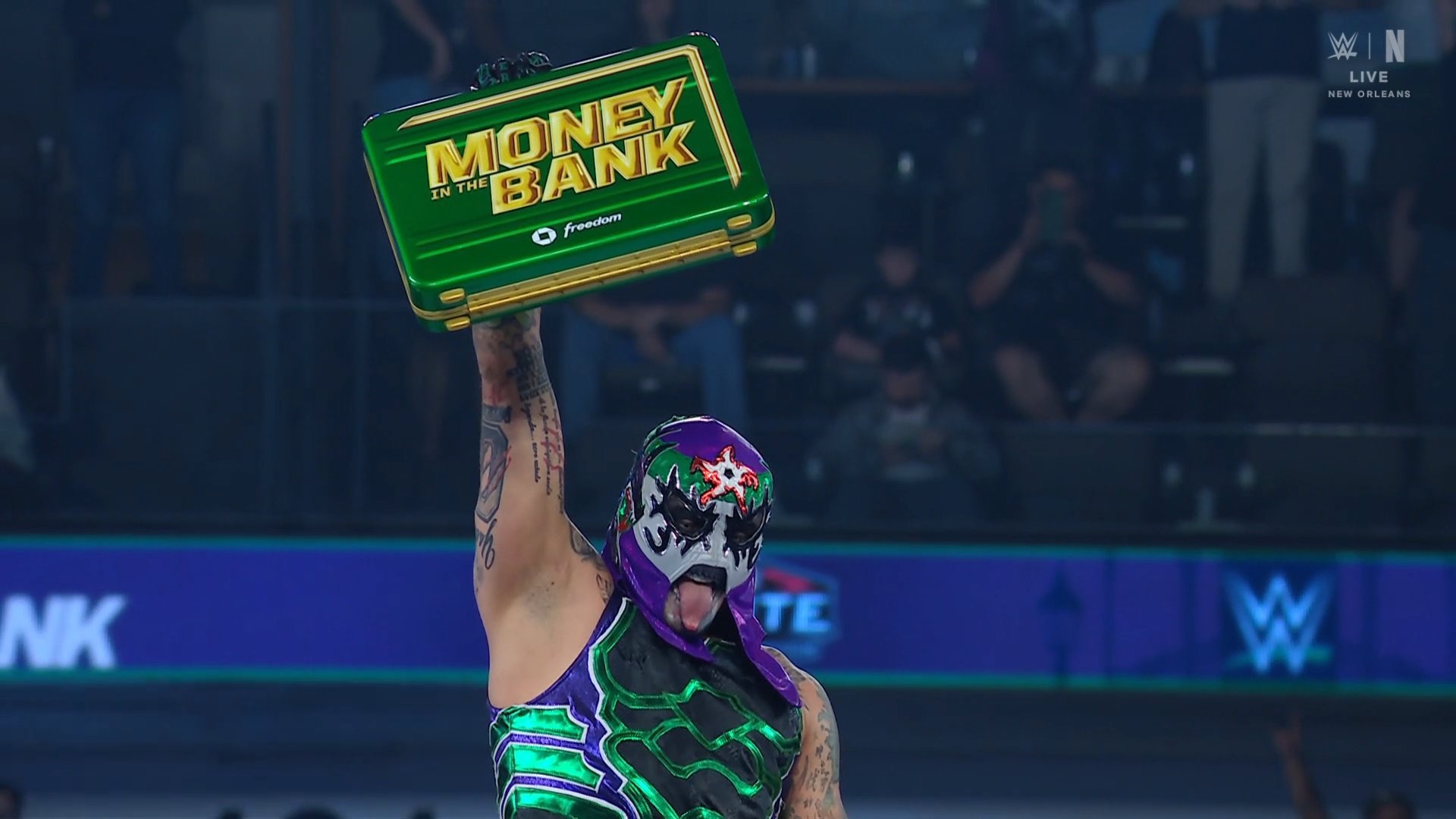 Penta holding the Money in the Bank briefcase after winning the men’s ladder match.